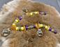Preview: Bernstein Fibelkette mit Gotland Sphären und Wikinger Perlen auf einem Fell