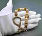 Preview: Wikinger Schlüssel Birfröst aus Bronze mit Glasperlenkette in braun/beige von Belanas Schatzkiste auf Hand